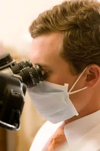 Man looking in to microscope